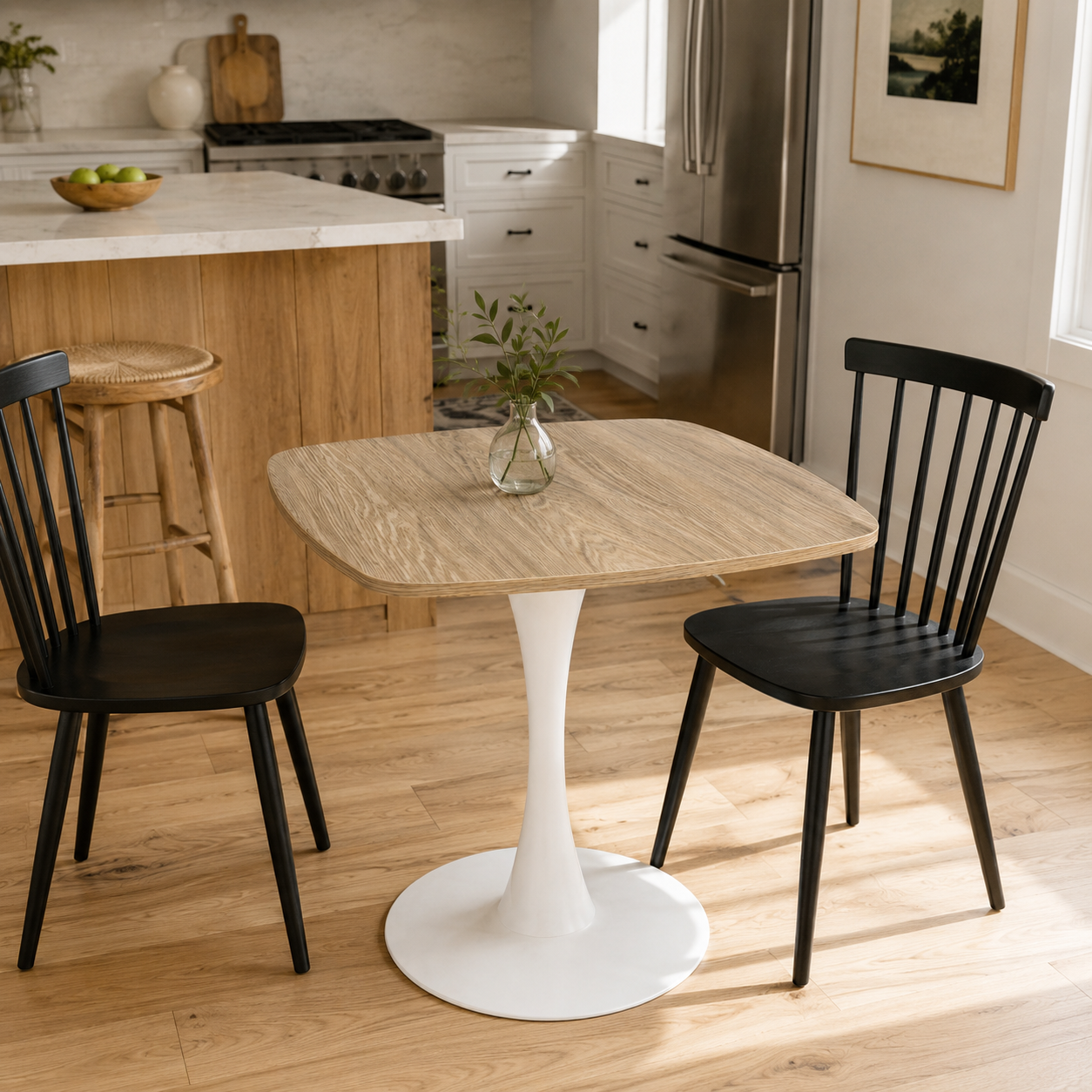 Faux oak square tulip bistro table in a kitchen flanked by two black spindle chairs