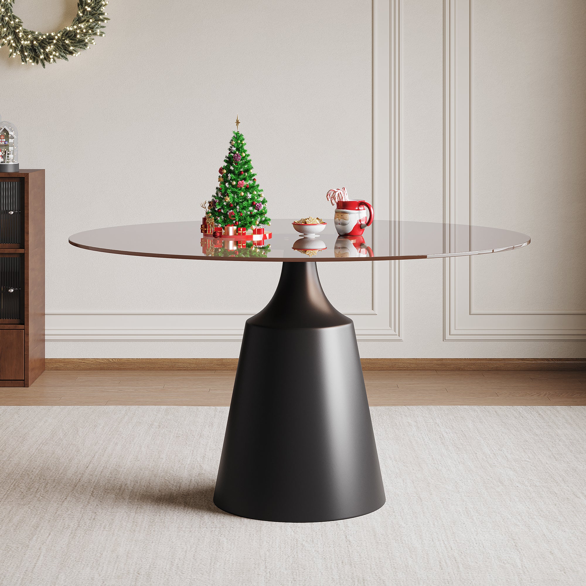 Round brown glass dining table with a black cone pedestal in a holiday-styled room, three-quarter view