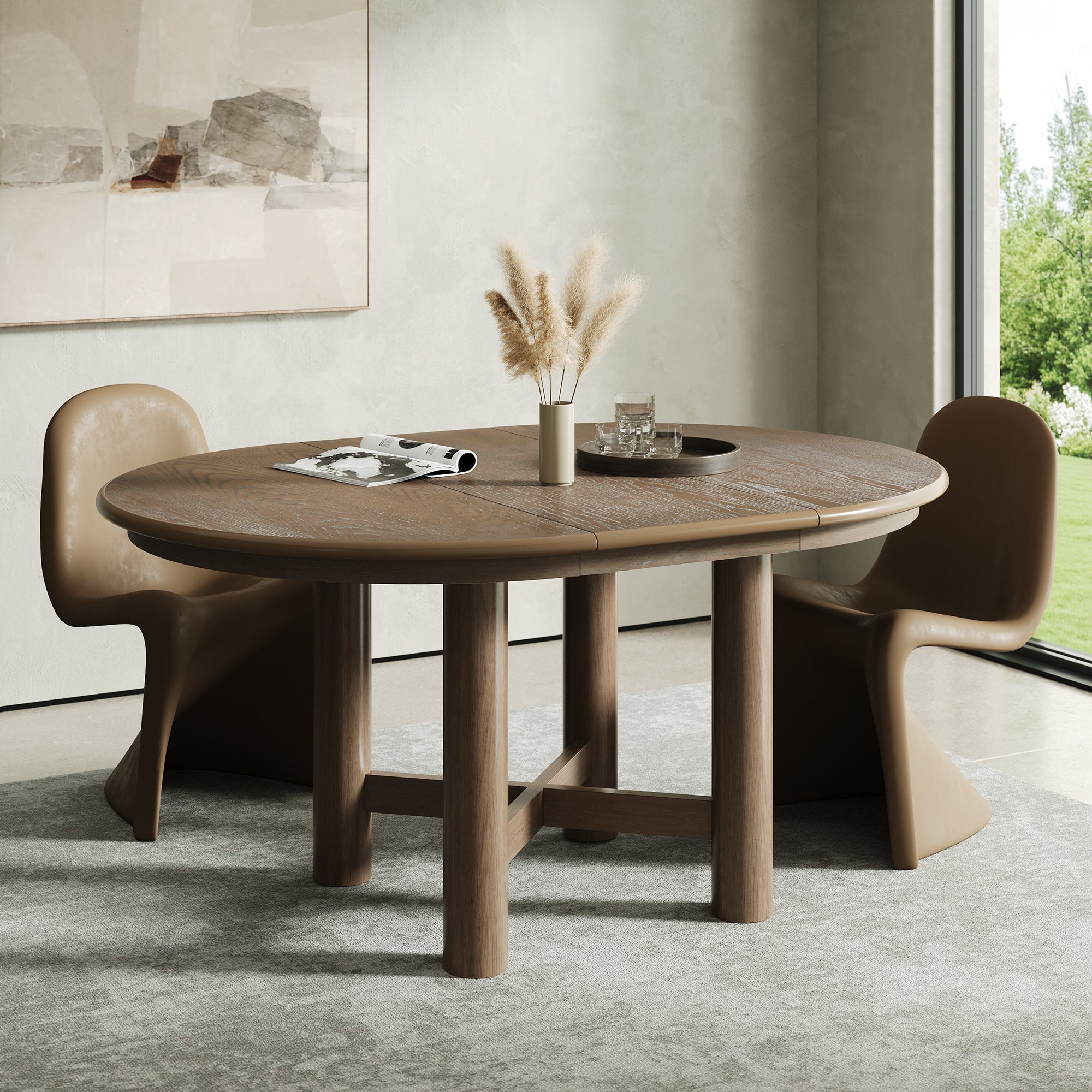 Round closed espresso oak table with two glossy tan chairs by a garden window