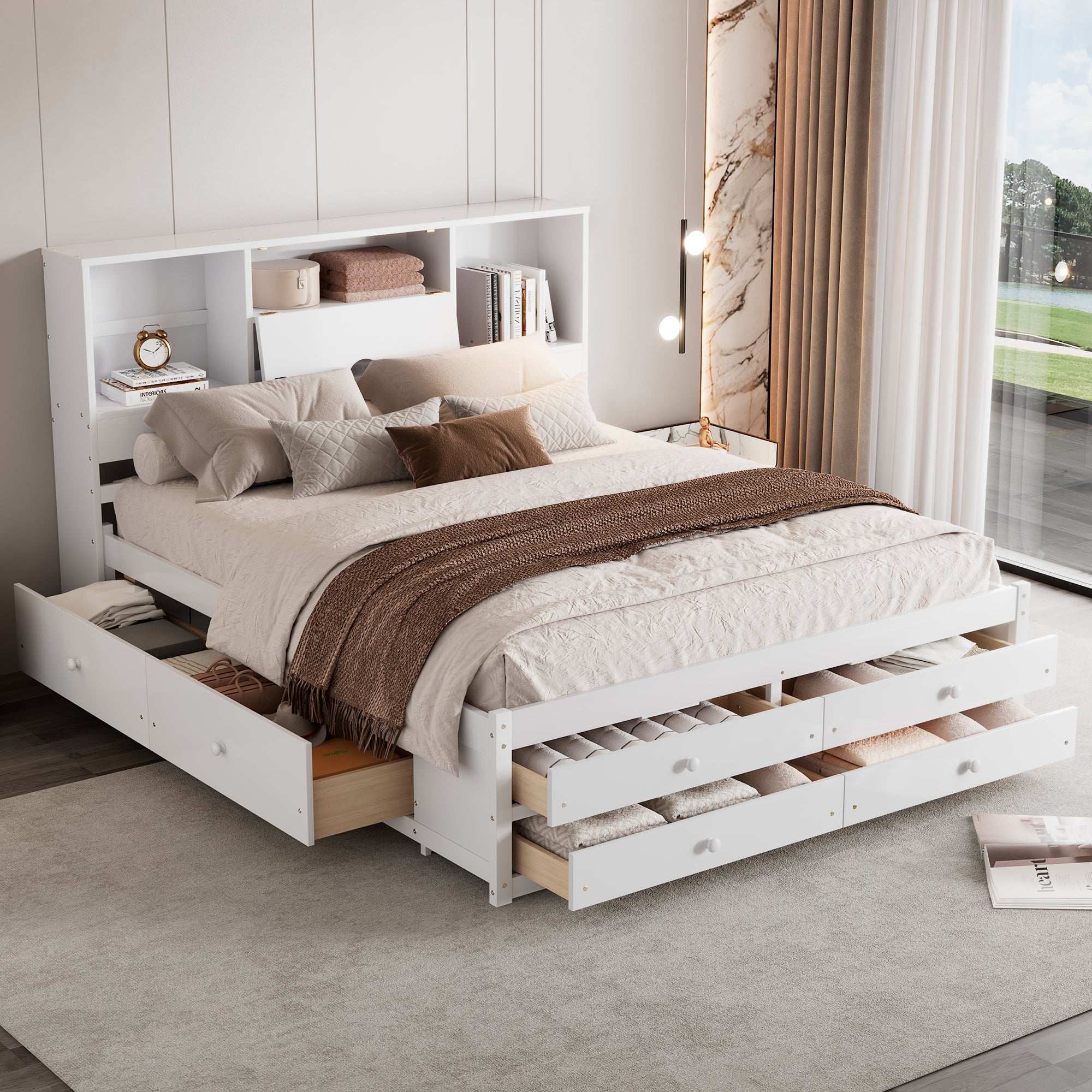 Angled view of the white storage bed with bookcase headboard, side drawers and footboard drawers pulled open