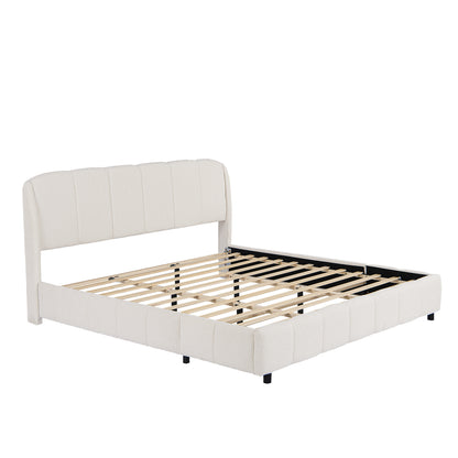 Angled view of beige bouclé king platform bed frame and wood slats