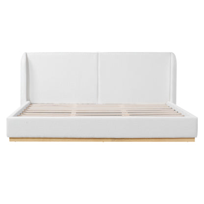 White bouclé king bed frame styled in a bedroom with abstract wall art