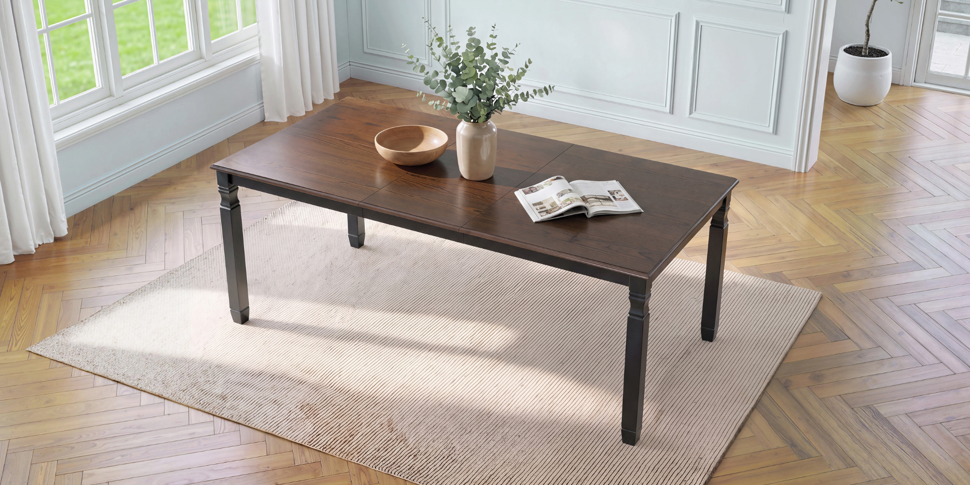Espresso oak veneer farmhouse extendable dining table, three-quarter overhead view in a sunlit room