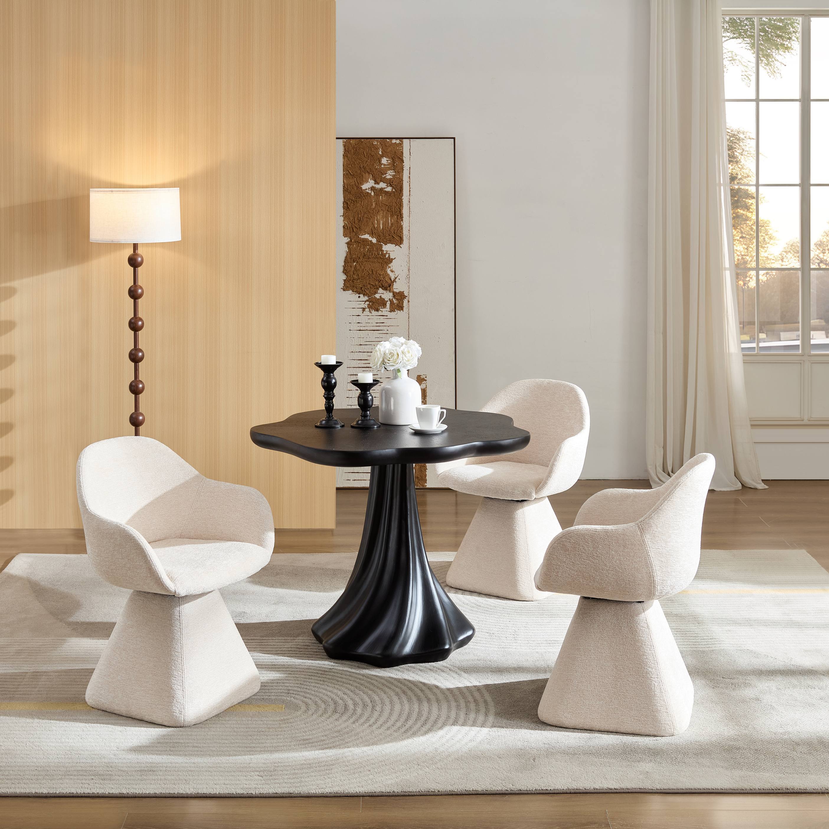 Black petal dining table styled in a living room with three cream boucle chairs and a floor lamp