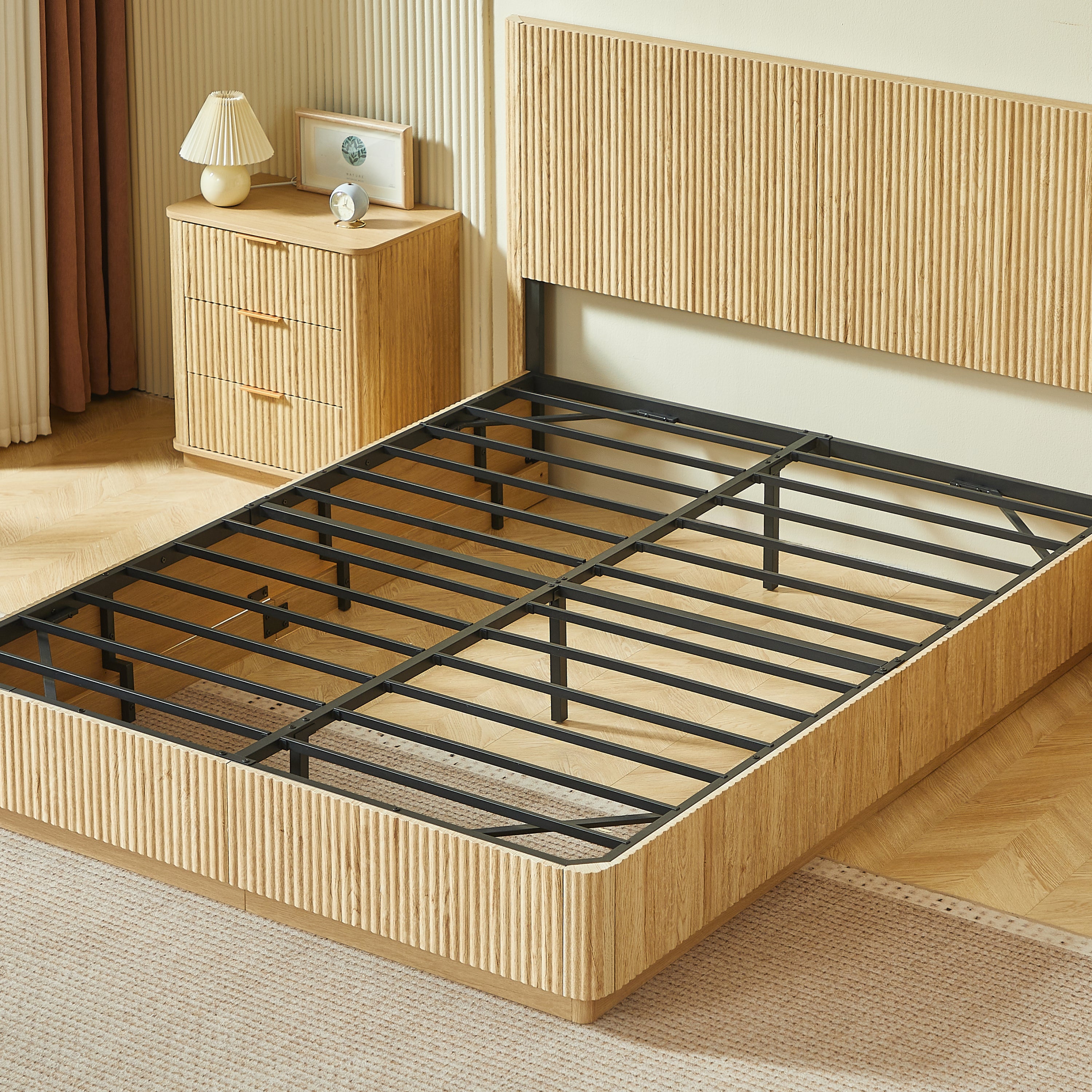 Angled view of light oak fluted queen bed frame with bare metal slats and a matching nightstand #Color_Oak