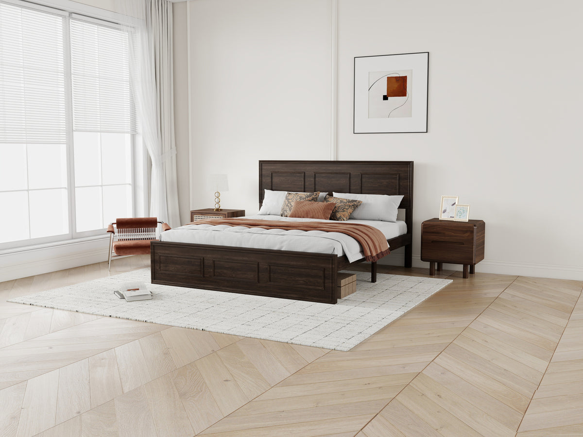 Angled wide view of rich brown wood queen bed with nightstands on light wood flooring