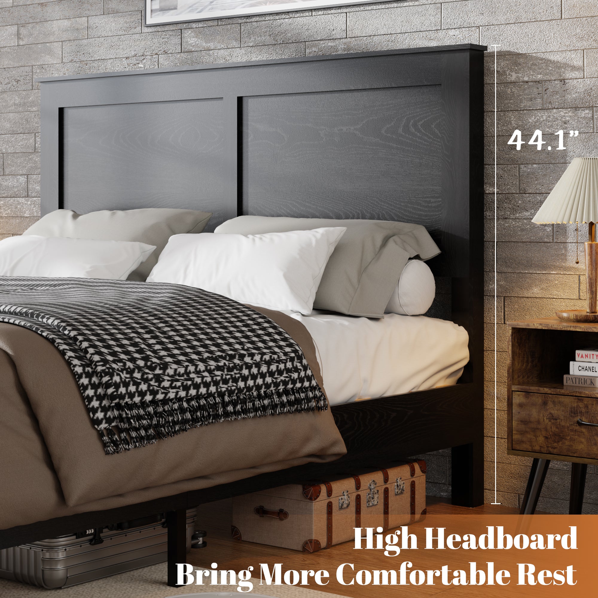 Side view of the tall panel headboard on the antique black queen platform bed with layered bedding