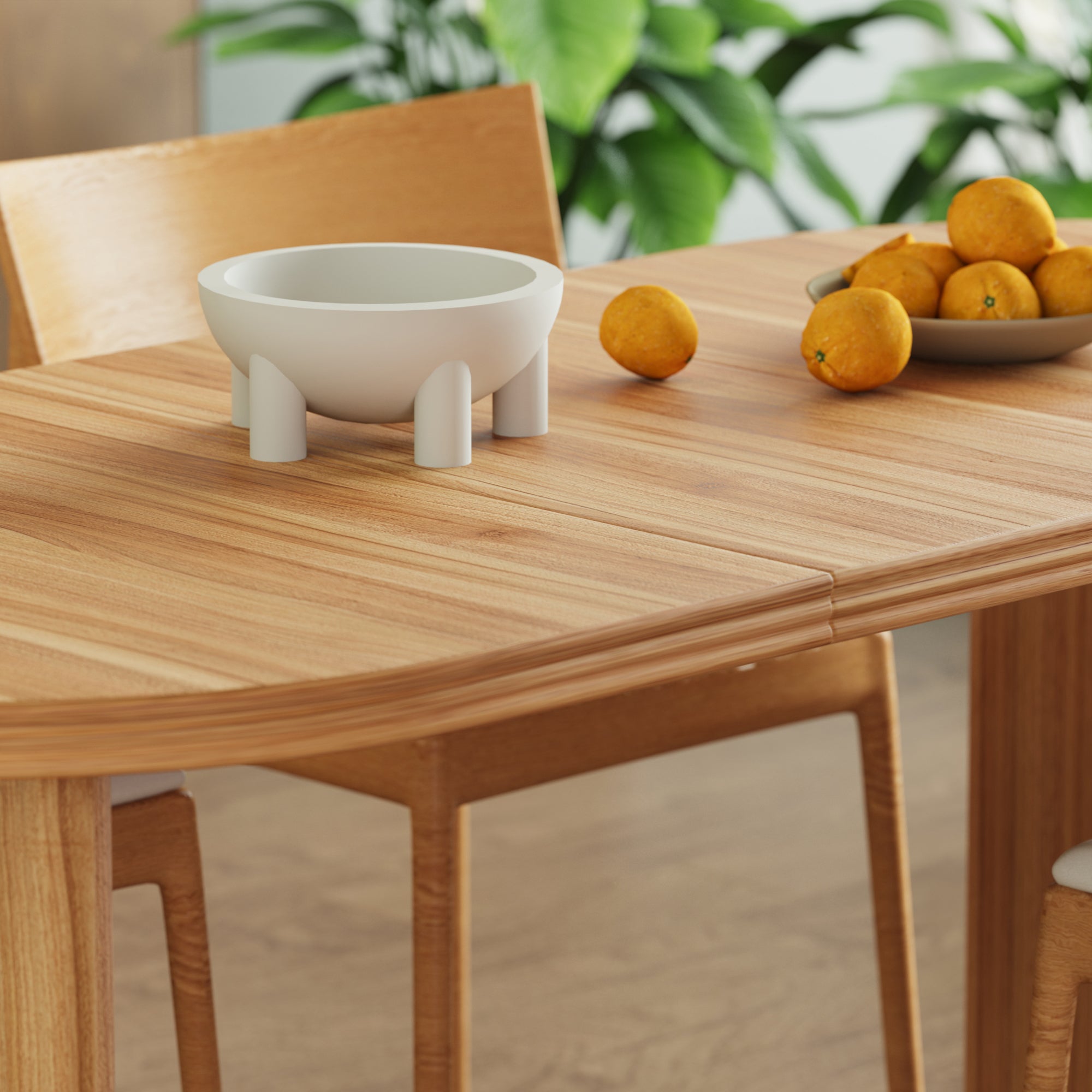 Close-up of the tabletop corner and center seam with a bowl and oranges