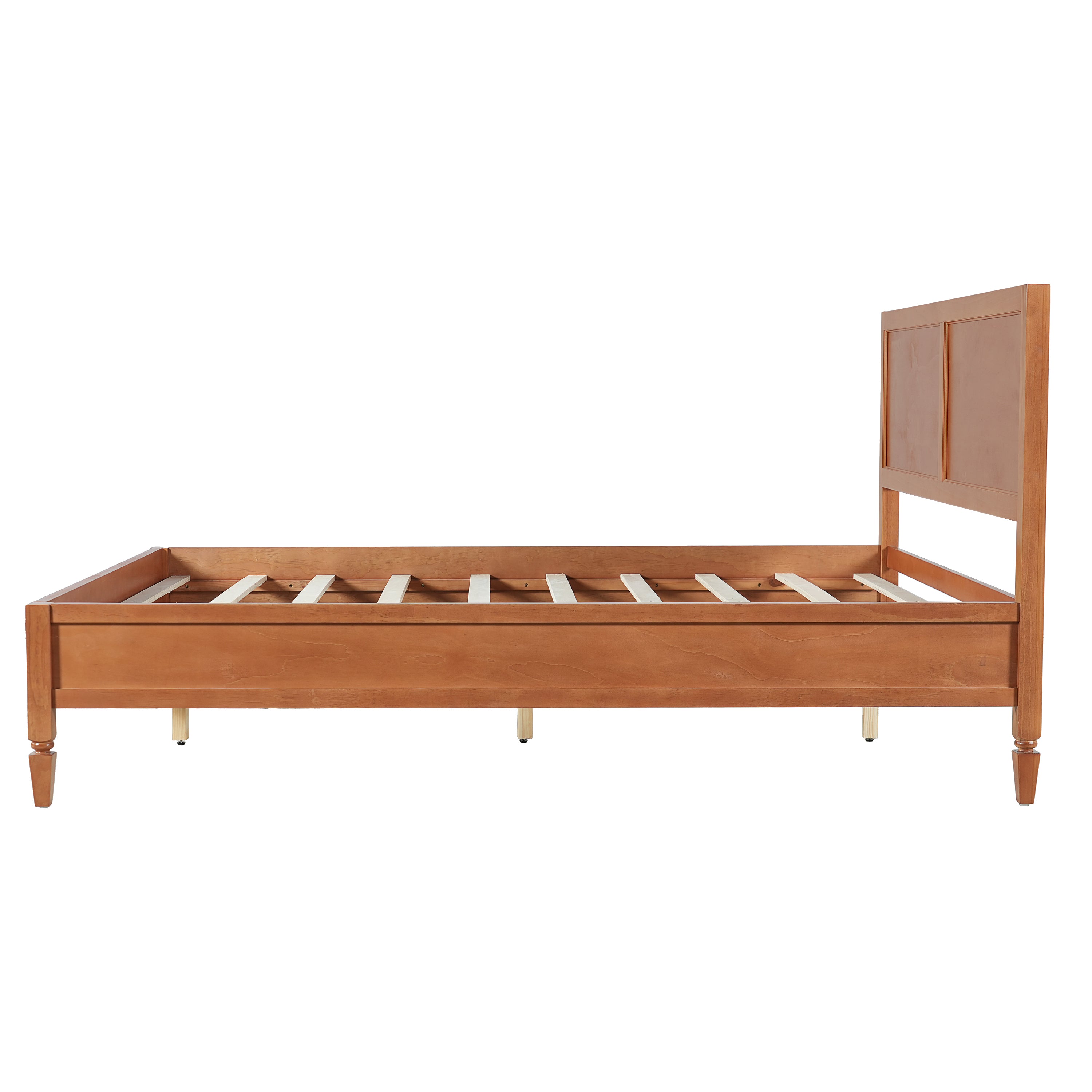 Side profile of the brown wood queen platform bed with panel headboard, turned legs and exposed slats