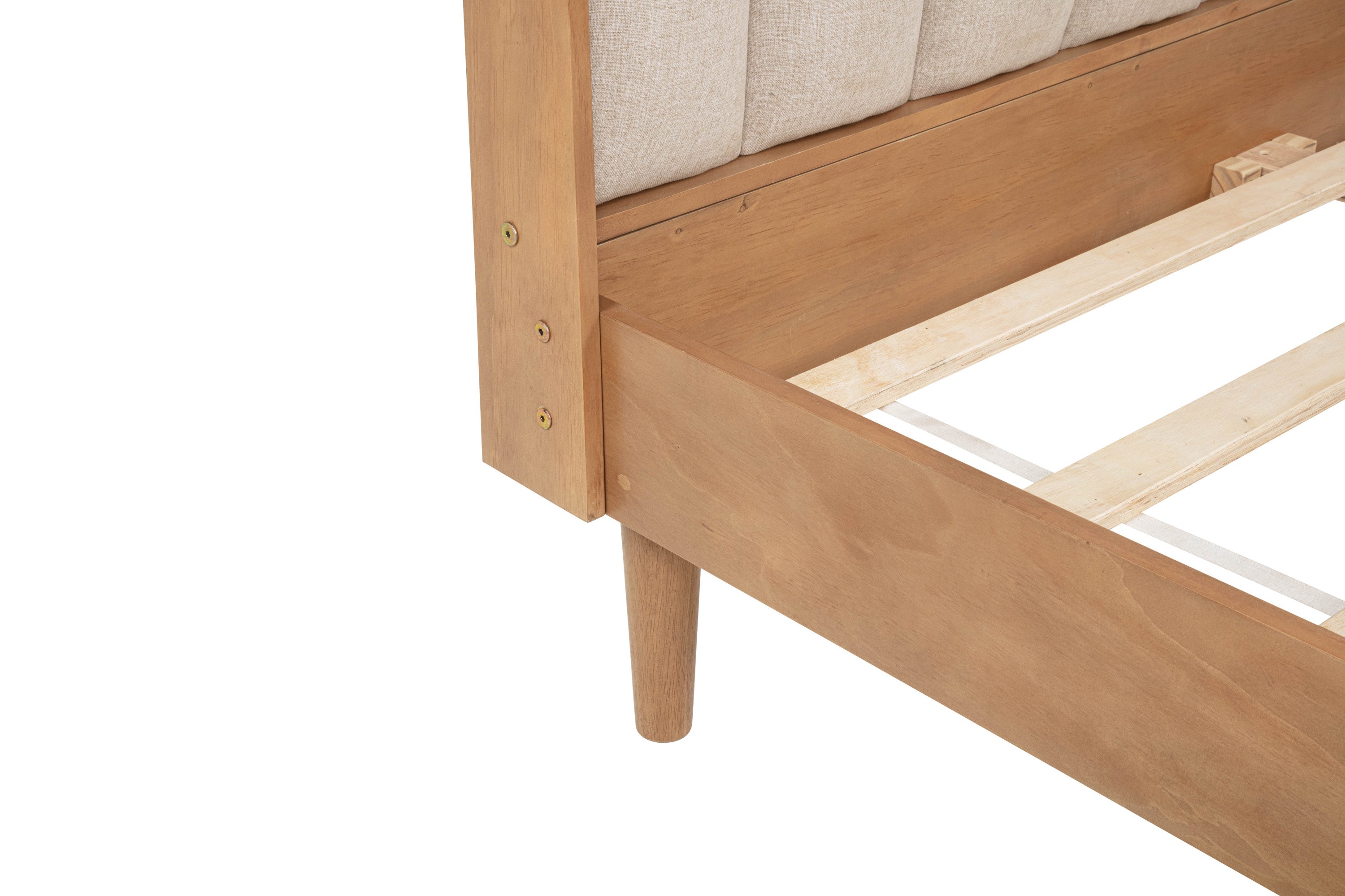 Corner joint detail: wood side rail bolted to the headboard post above a tapered leg
