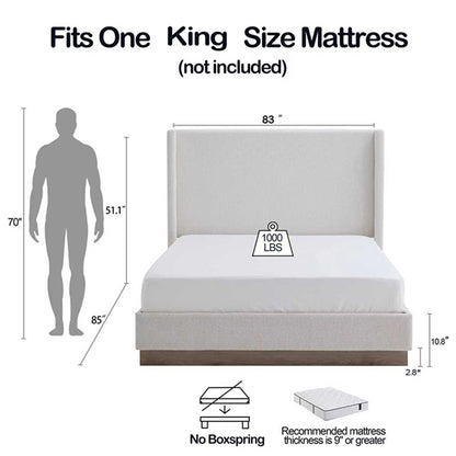 Cream king bed with wingback headboard, angled bedroom view