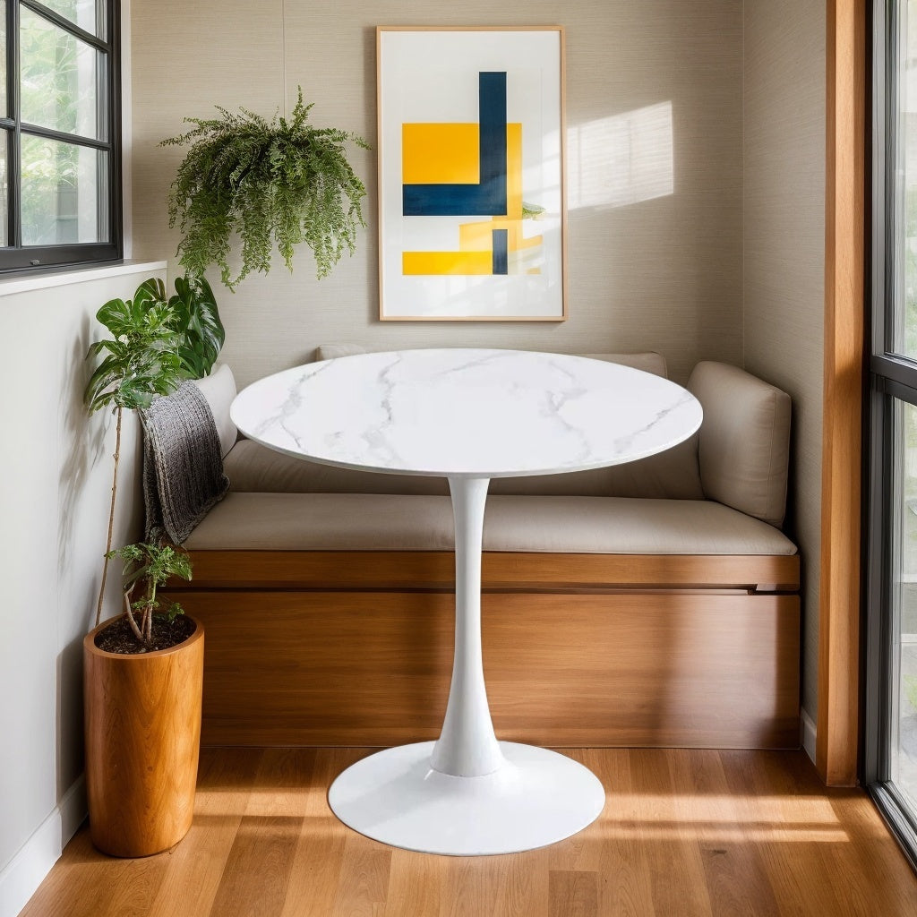 White marble tulip bistro table in a styled breakfast nook with a cushioned bench