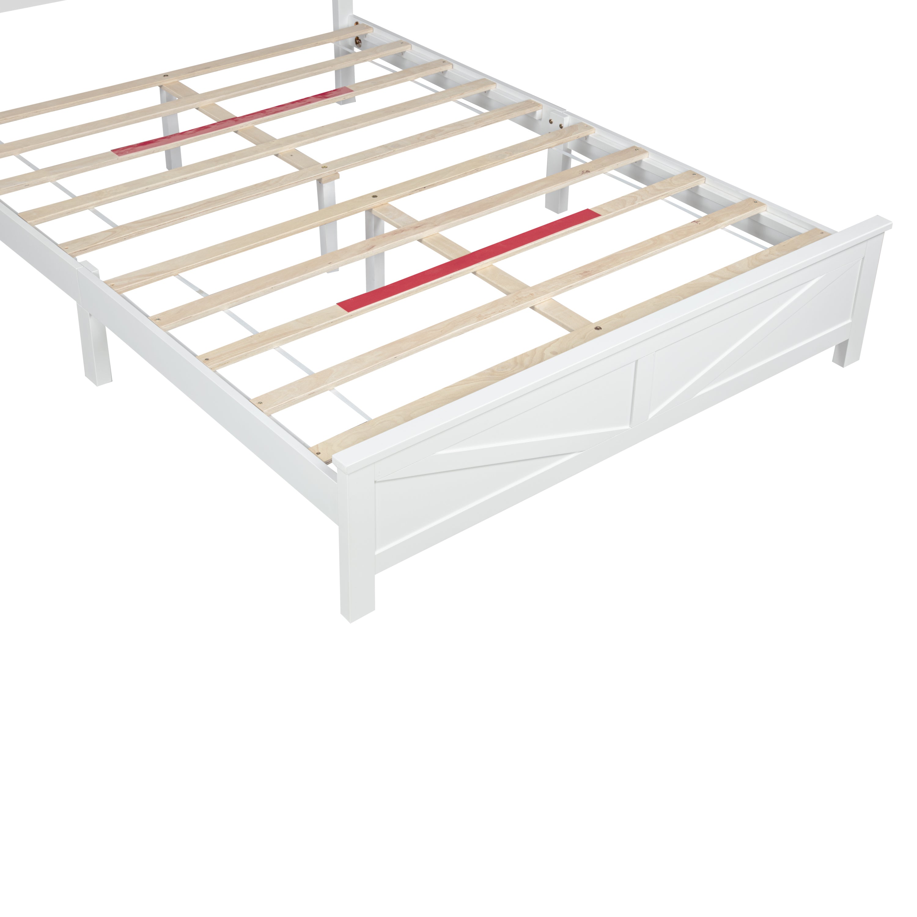 Close-up of the barn door footboard panel and center support legs beneath the wood slats