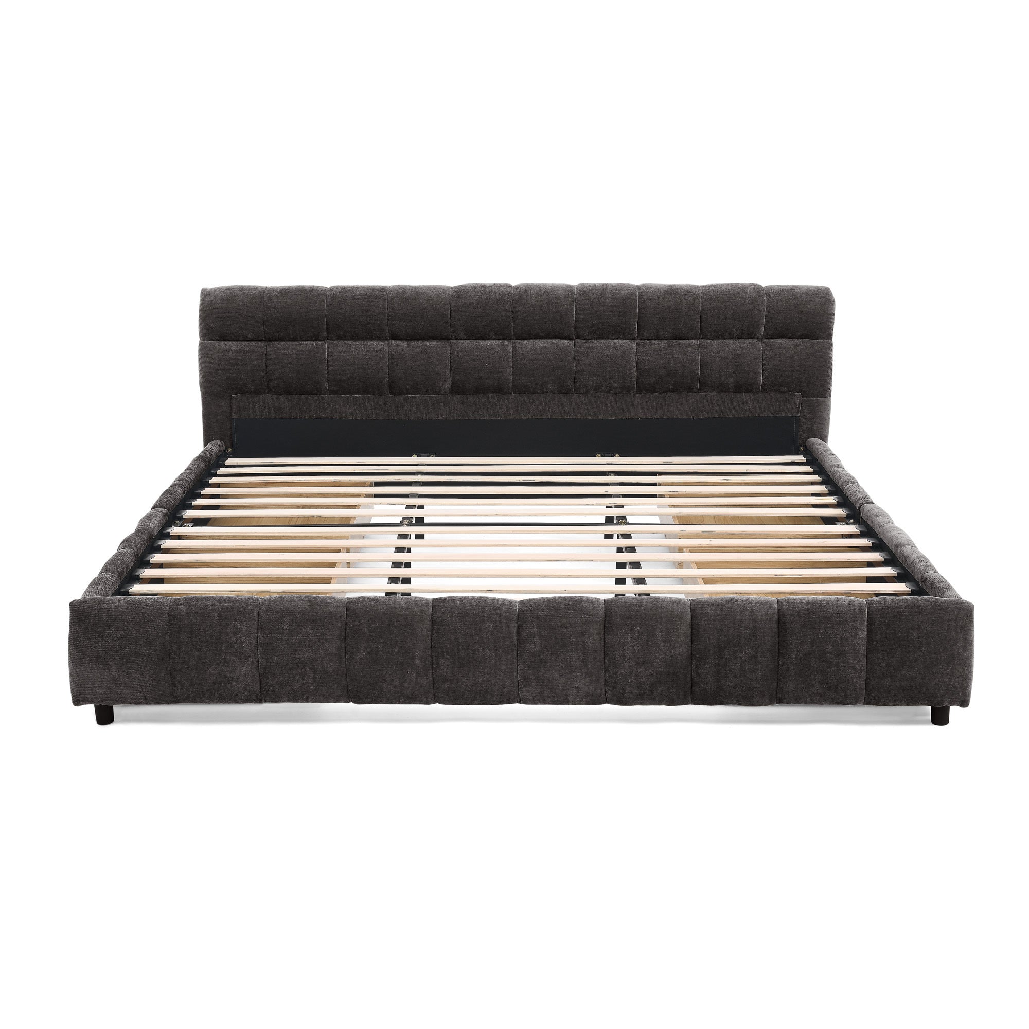 Storage drawer removed from dark gray king bed frame, empty interior