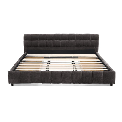 Storage drawer removed from dark gray king bed frame, empty interior