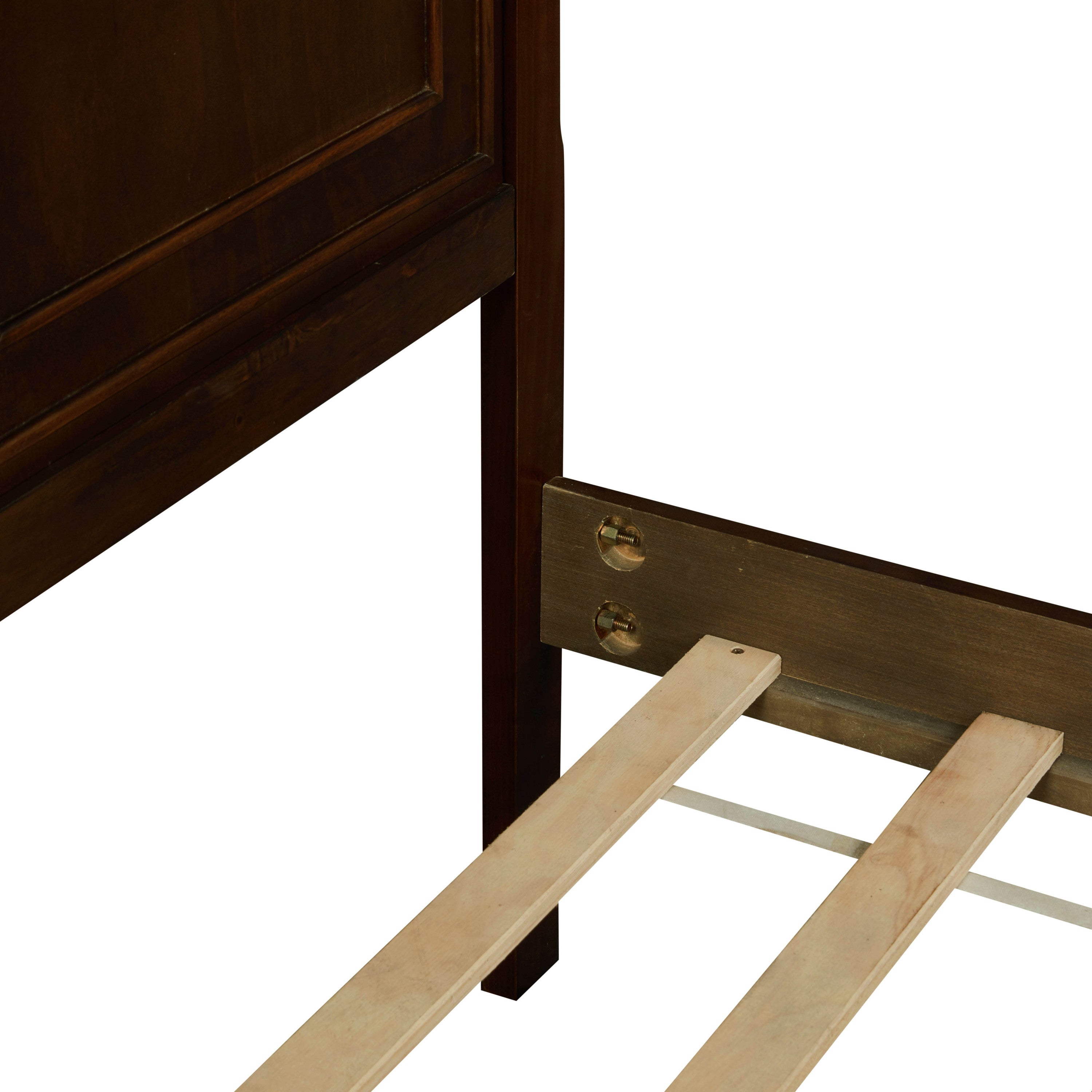 Close-up of the headboard leg and side-rail bolt connection on the brown queen bed
