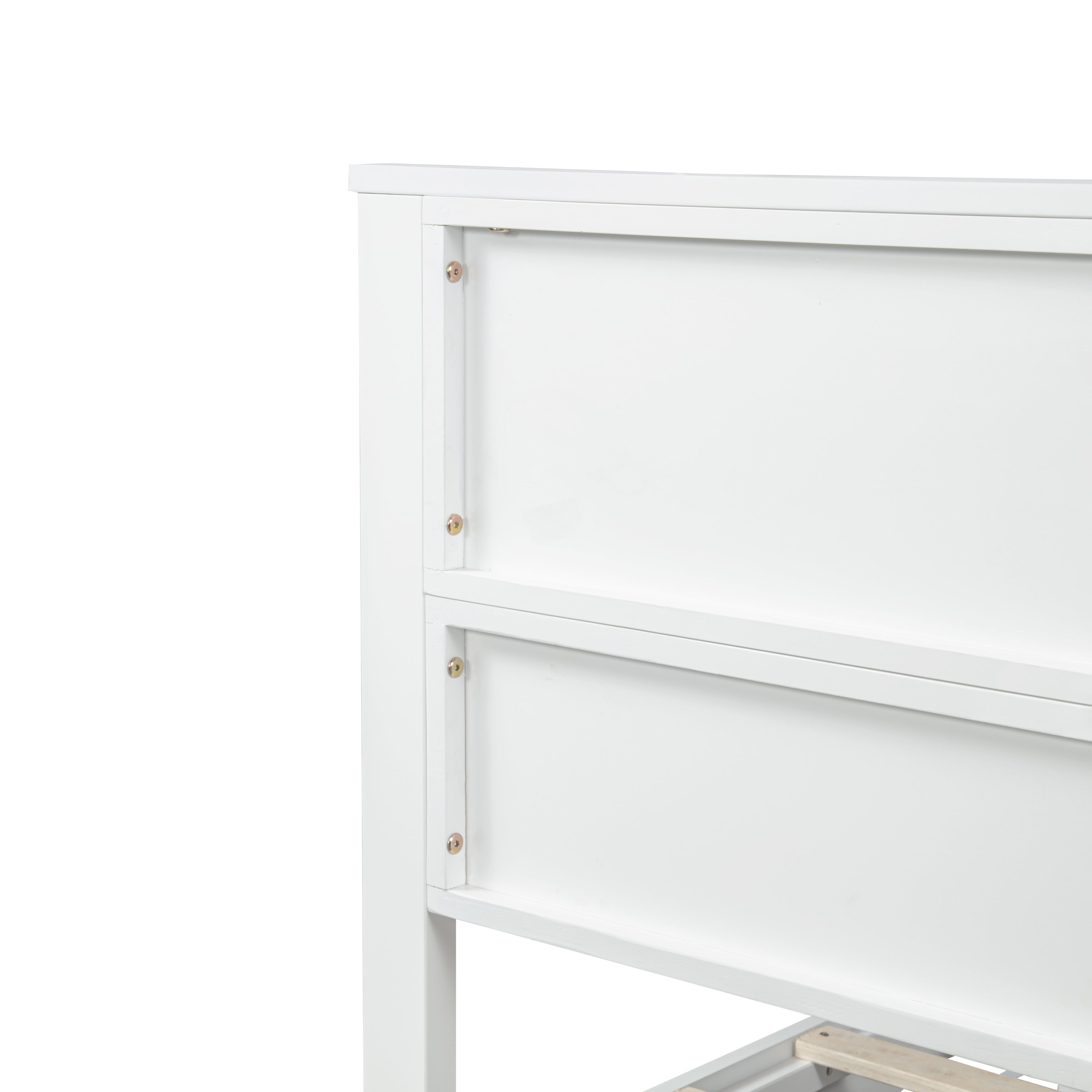 Close-up of the white barn door panel top corner joint secured with screws