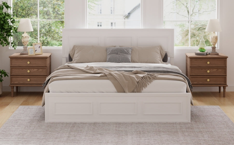 Front view of the white queen bed frame, three-panel headboard and low panel footboard, bright windows behind #Color_White