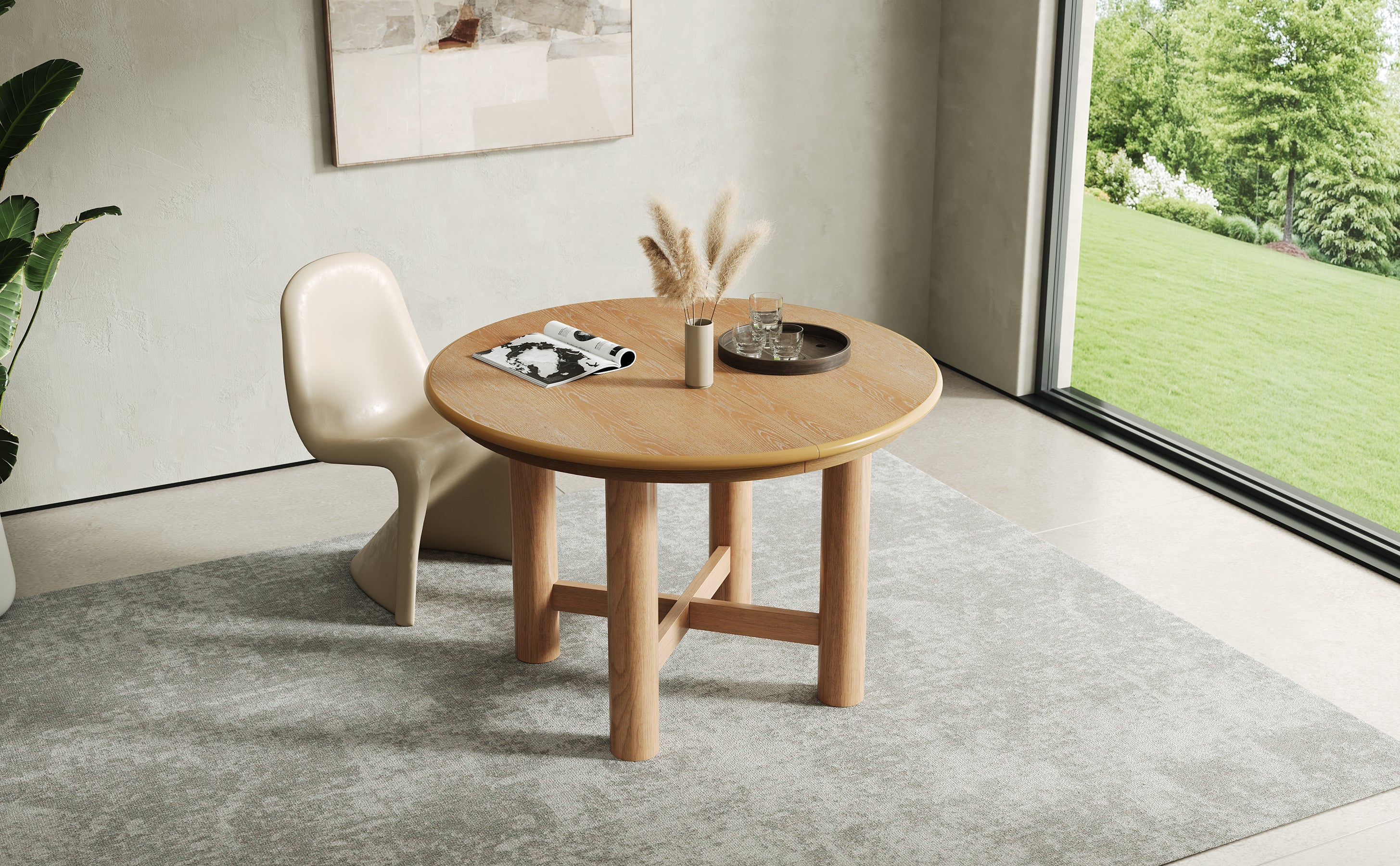 Three-quarter lifestyle view of the extended oval oak table with cream chairs
