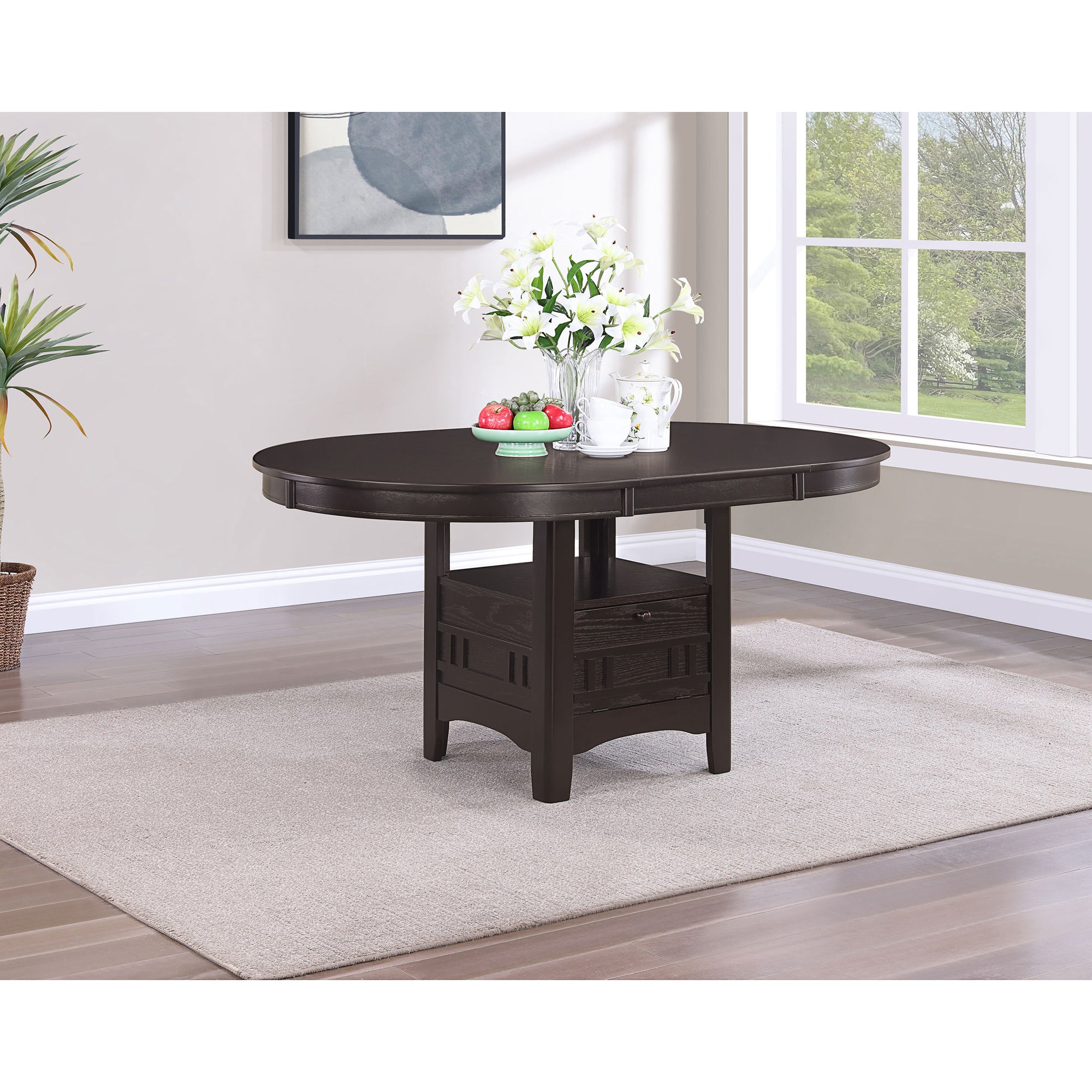 Espresso oval dining table styled with flowers and fruit in a bright room