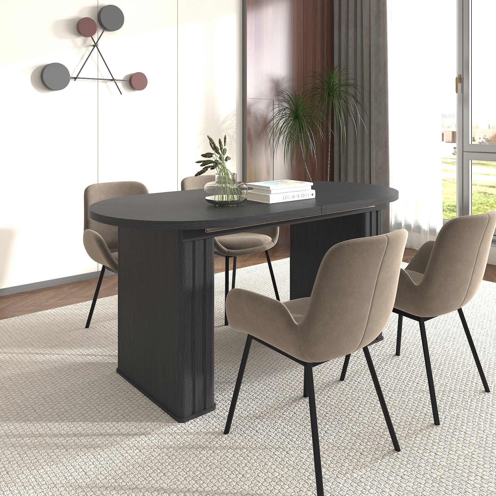 Black oval extendable dining table with tan upholstered chairs near a window, angled view
