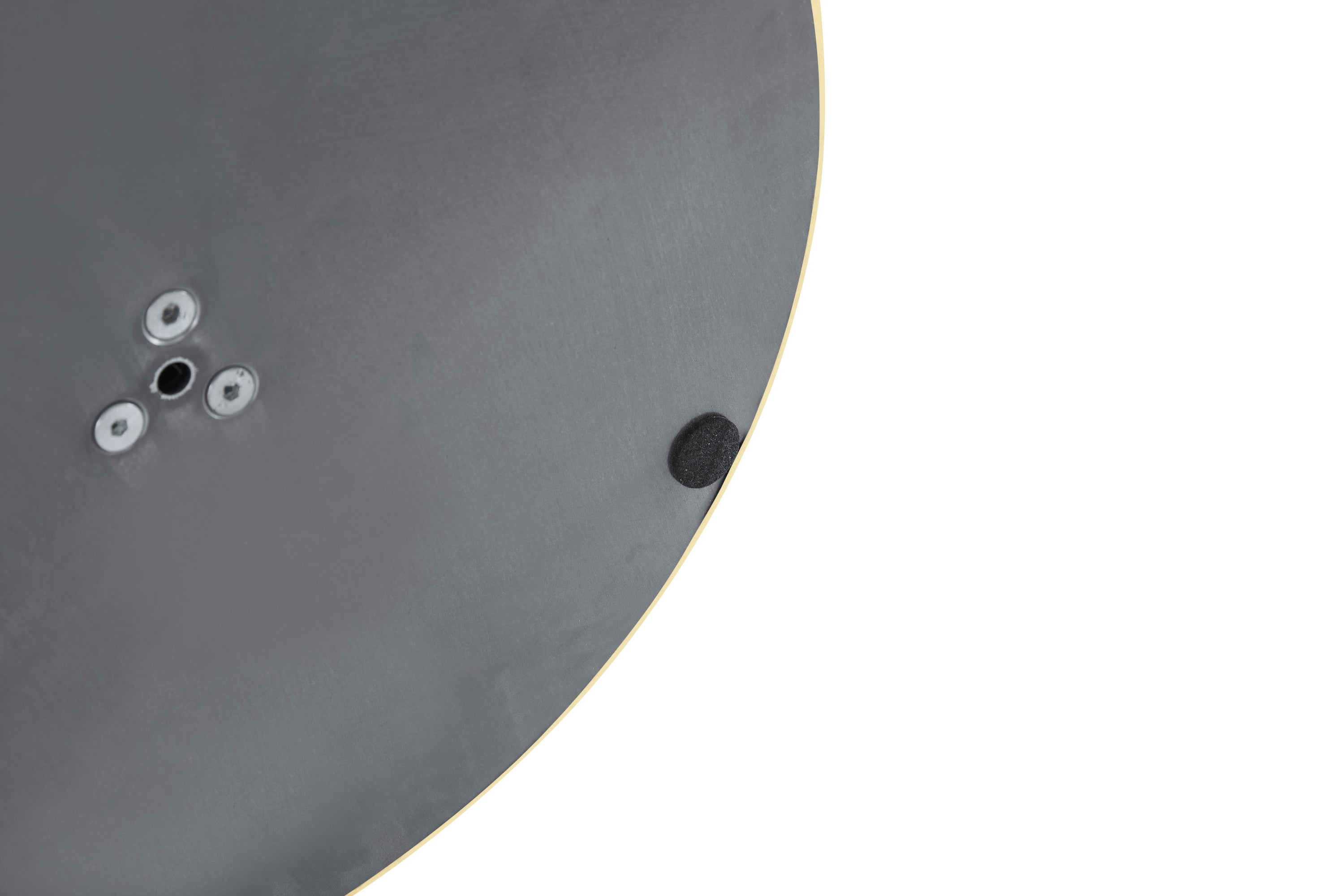 Close-up of the base underside showing leveling screw holes and a black non-slip pad