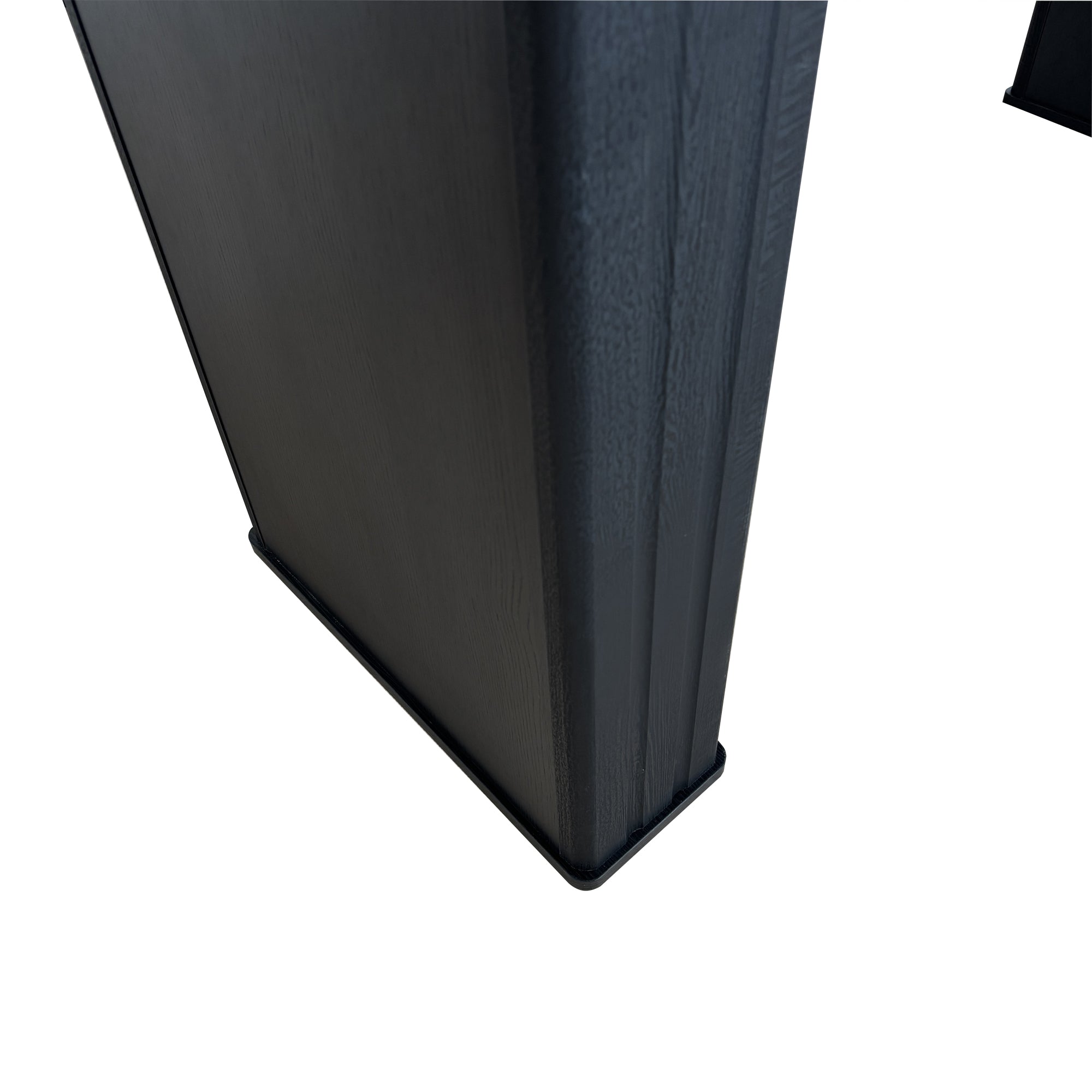 Close-up of the grooved black pedestal leg base of the dining table