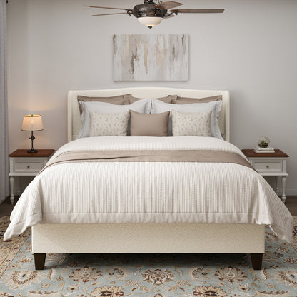 White teddy velvet king bed with camelback headboard styled with pillows