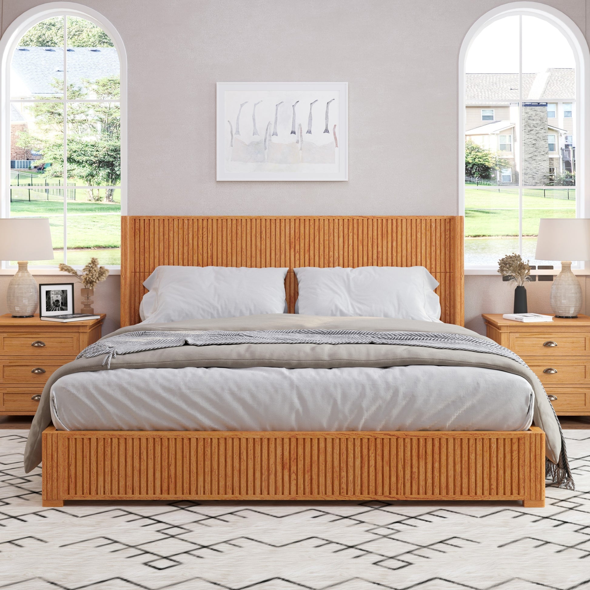 Natural wood floor bed frame in bright bedroom with arched windows