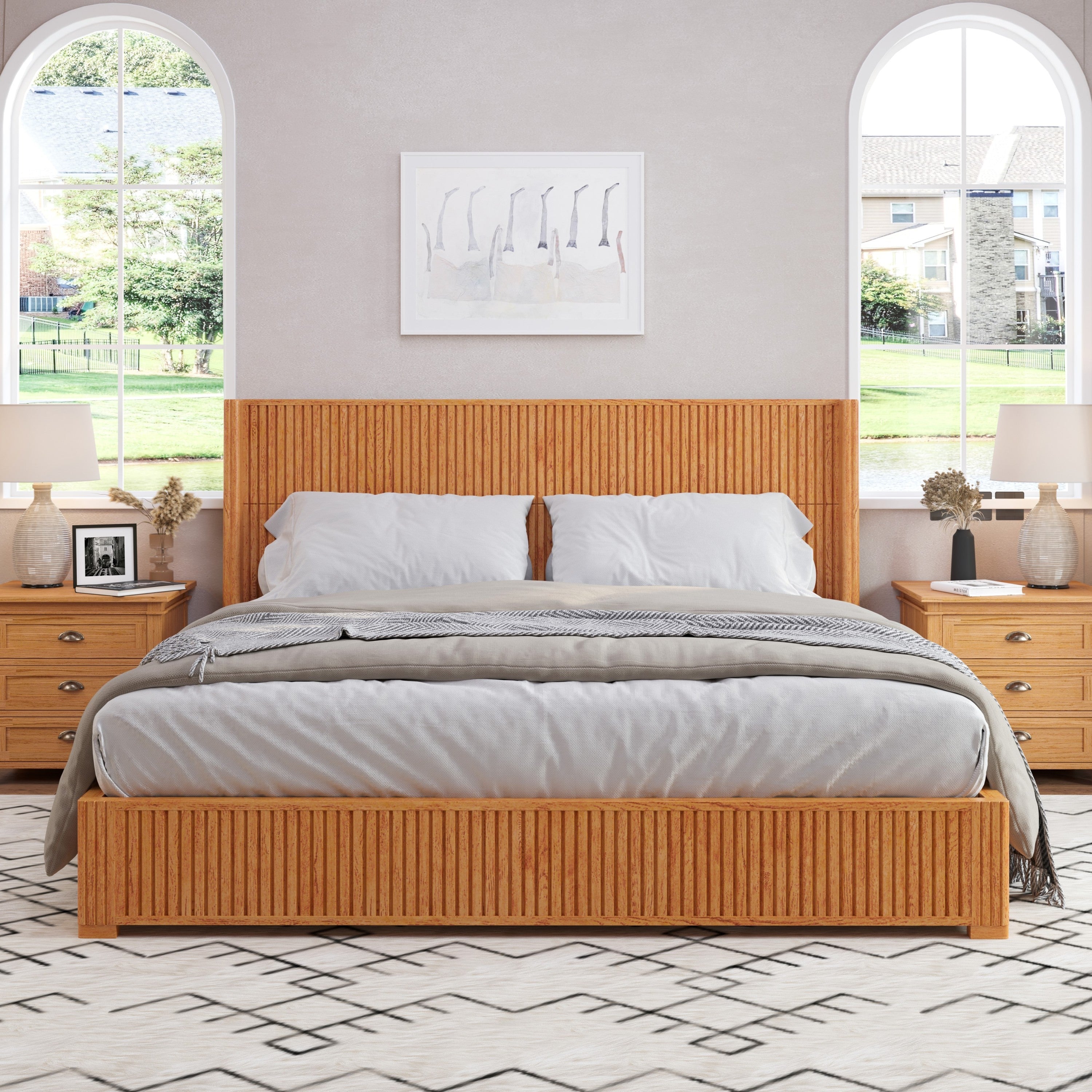 Natural wood floor bed frame in bright bedroom with arched windows