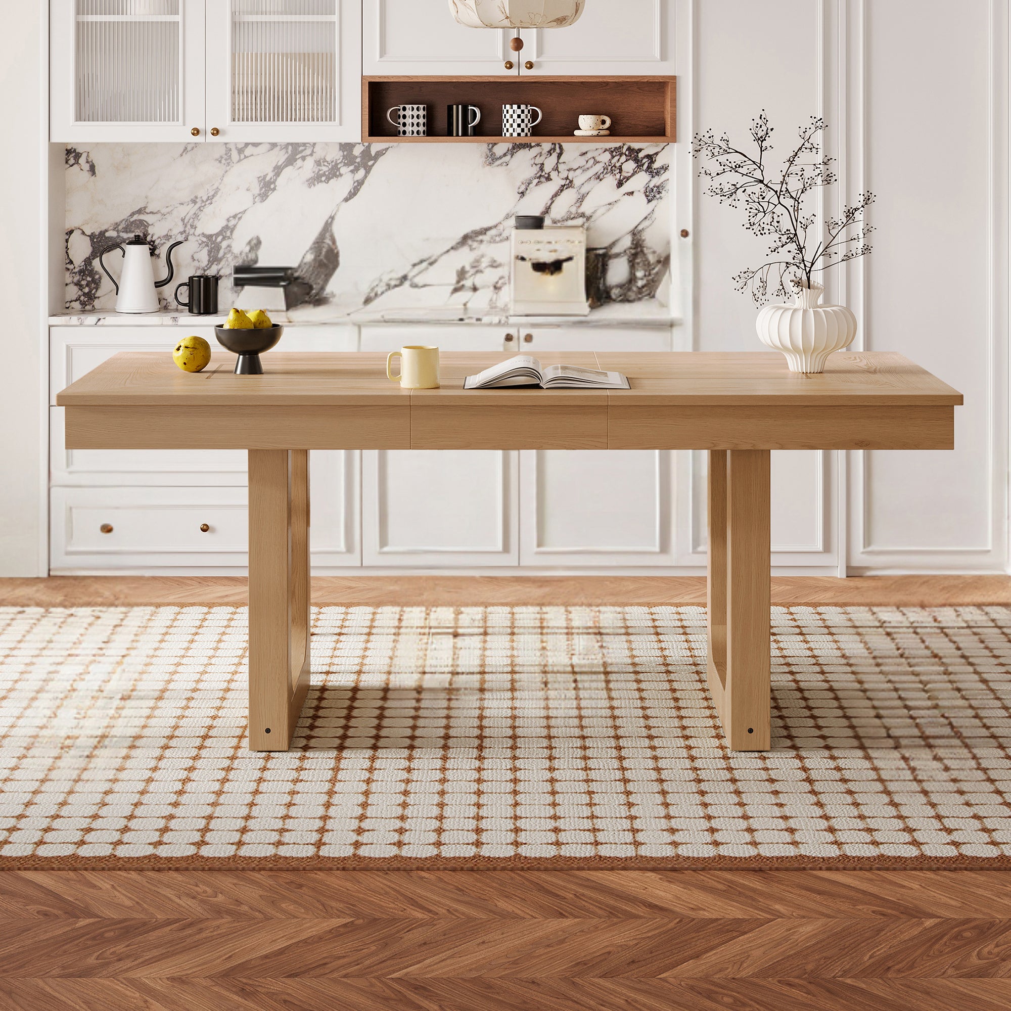 Front view of the natural oak extendable dining table in a styled kitchen with marble backsplash