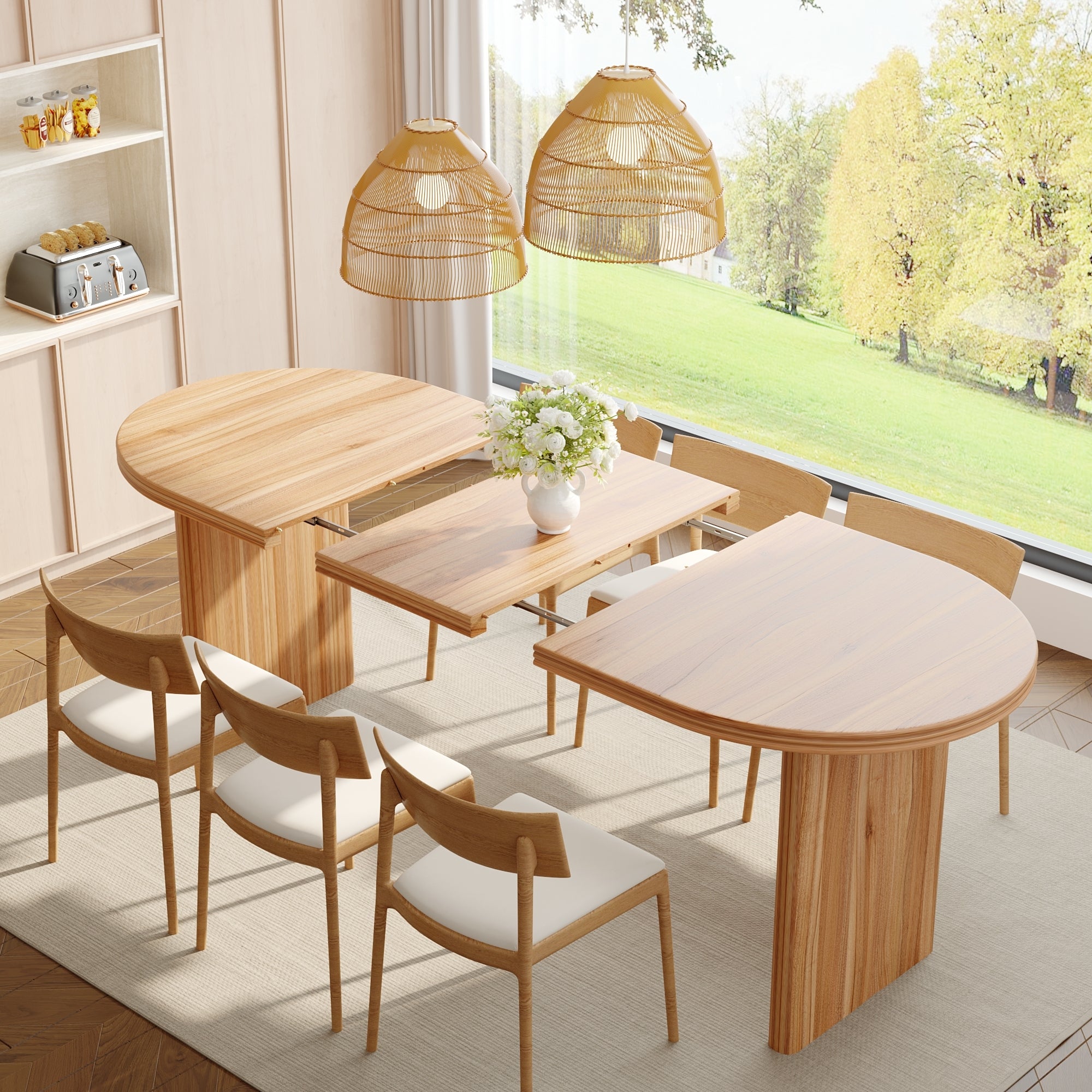 Overhead view of walnut-tone oval extendable dining table mid-expansion with the center leaf lifted out