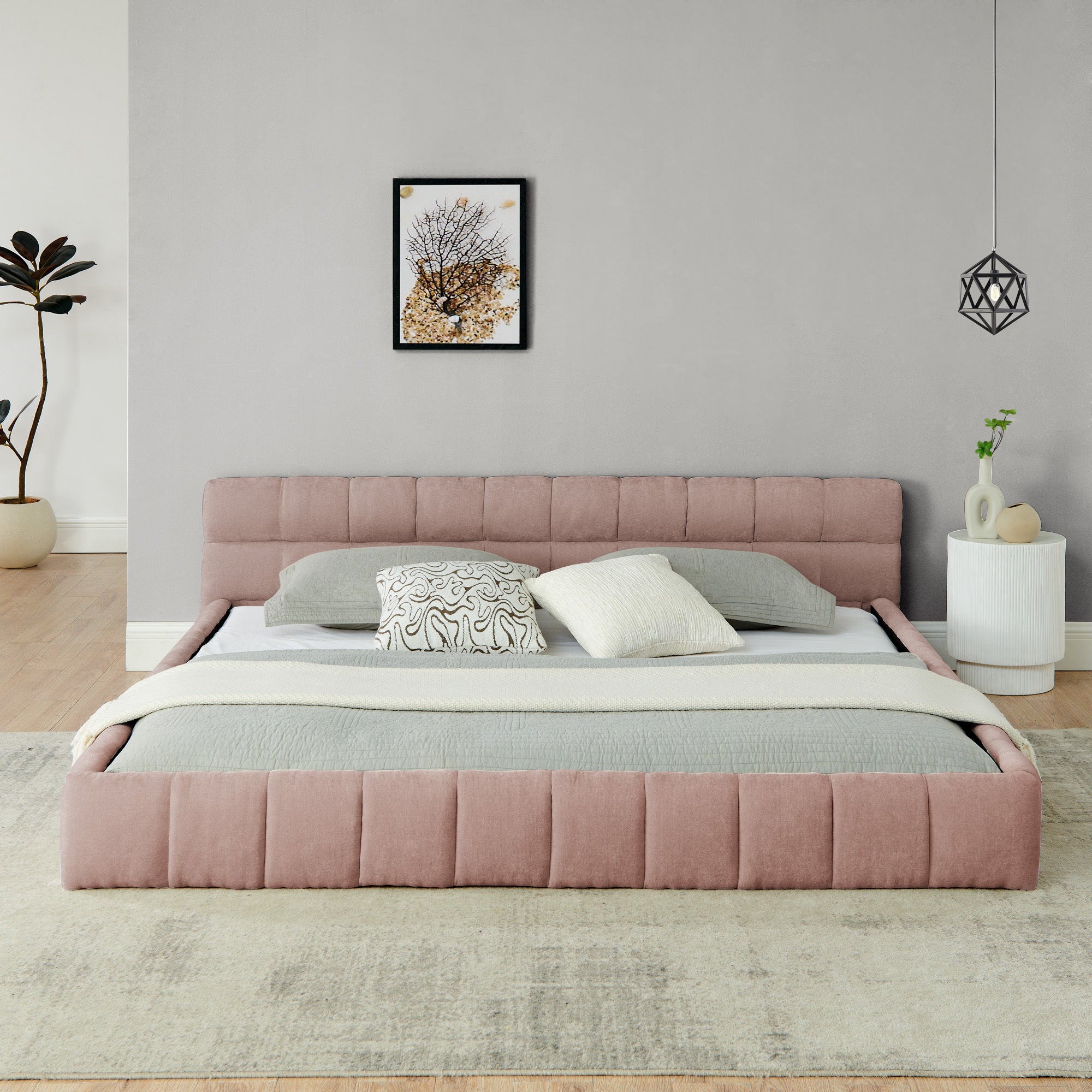 Pink chenille king bed frame viewed head-on with gray and cream bedding