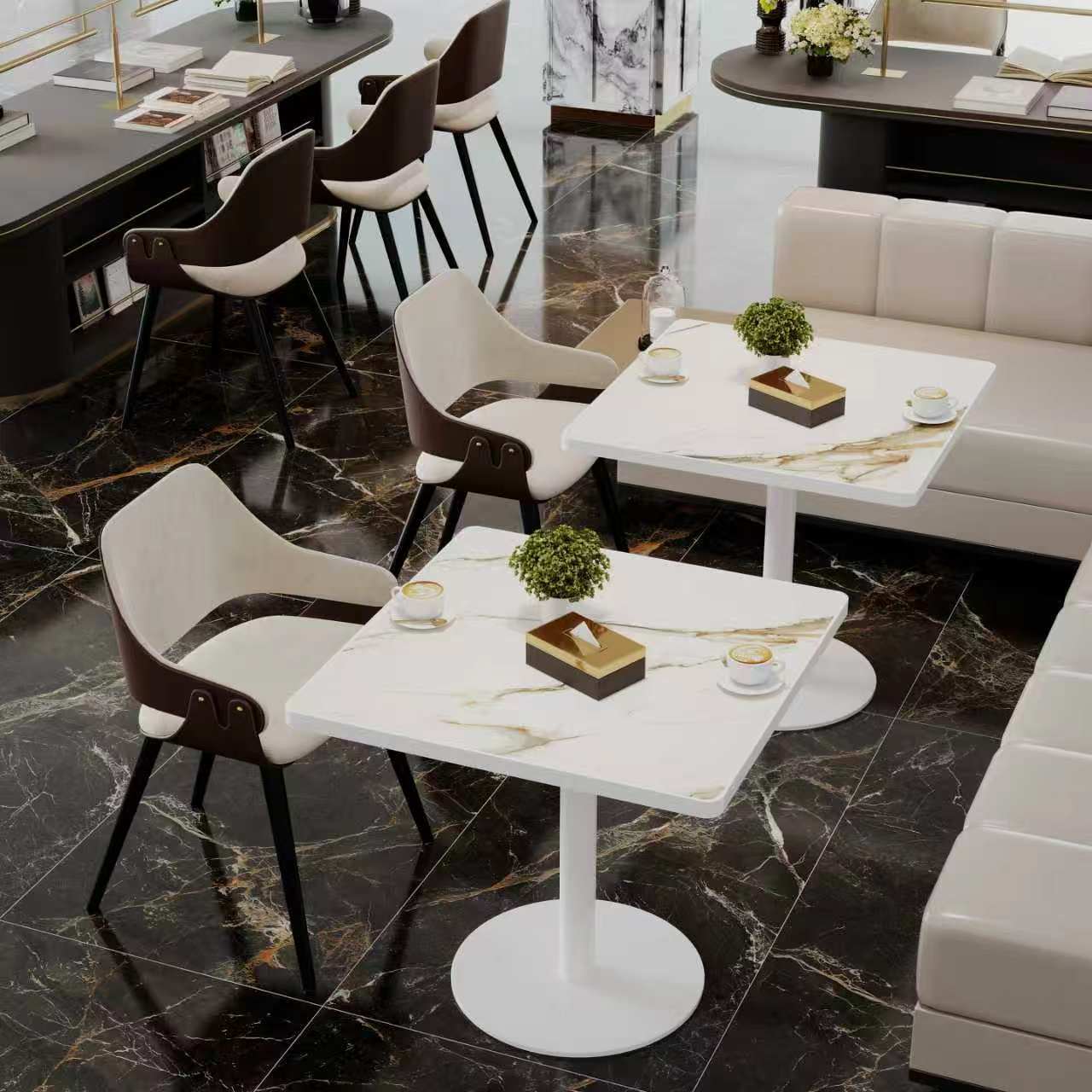White stone square tables with white bases in a black marble-floored cafe lounge