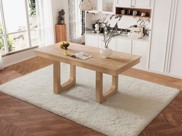 Three-quarter view of the oak farmhouse dining table styled in a bright dining room