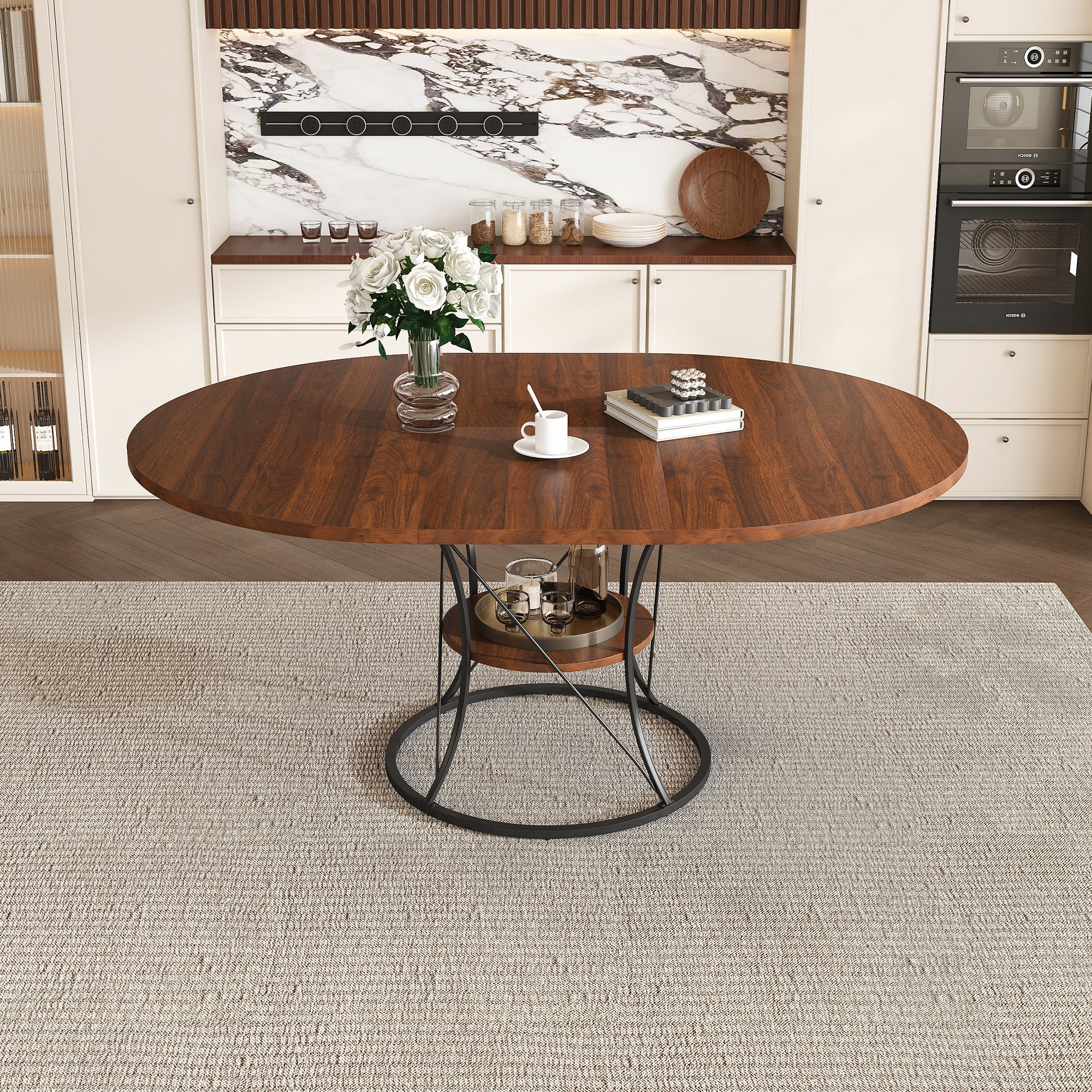 Walnut table extended to oval mode with the black iron base in a kitchen, front view