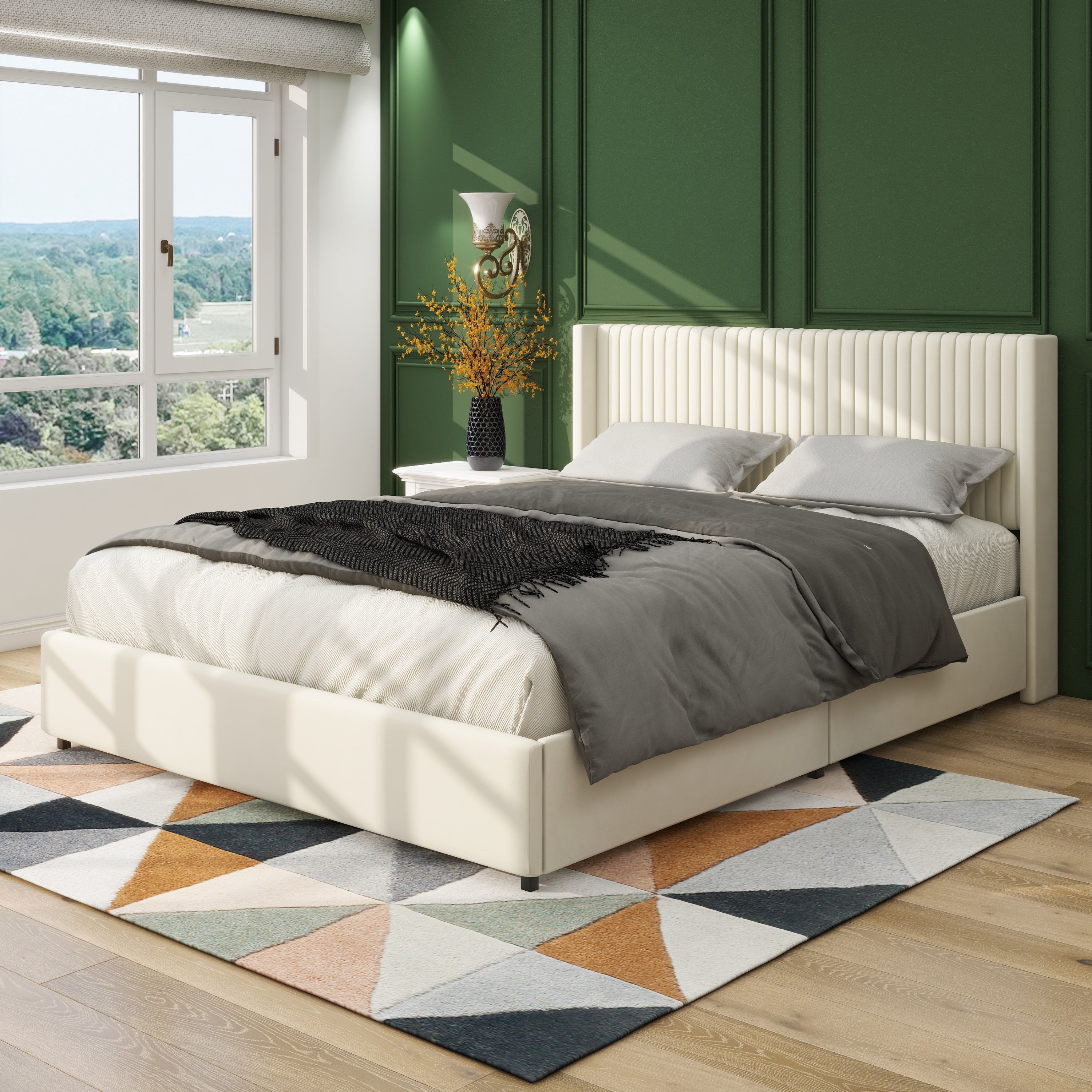 Ivory velvet wingback storage bed styled with gray bedding against a green paneled wall by a window