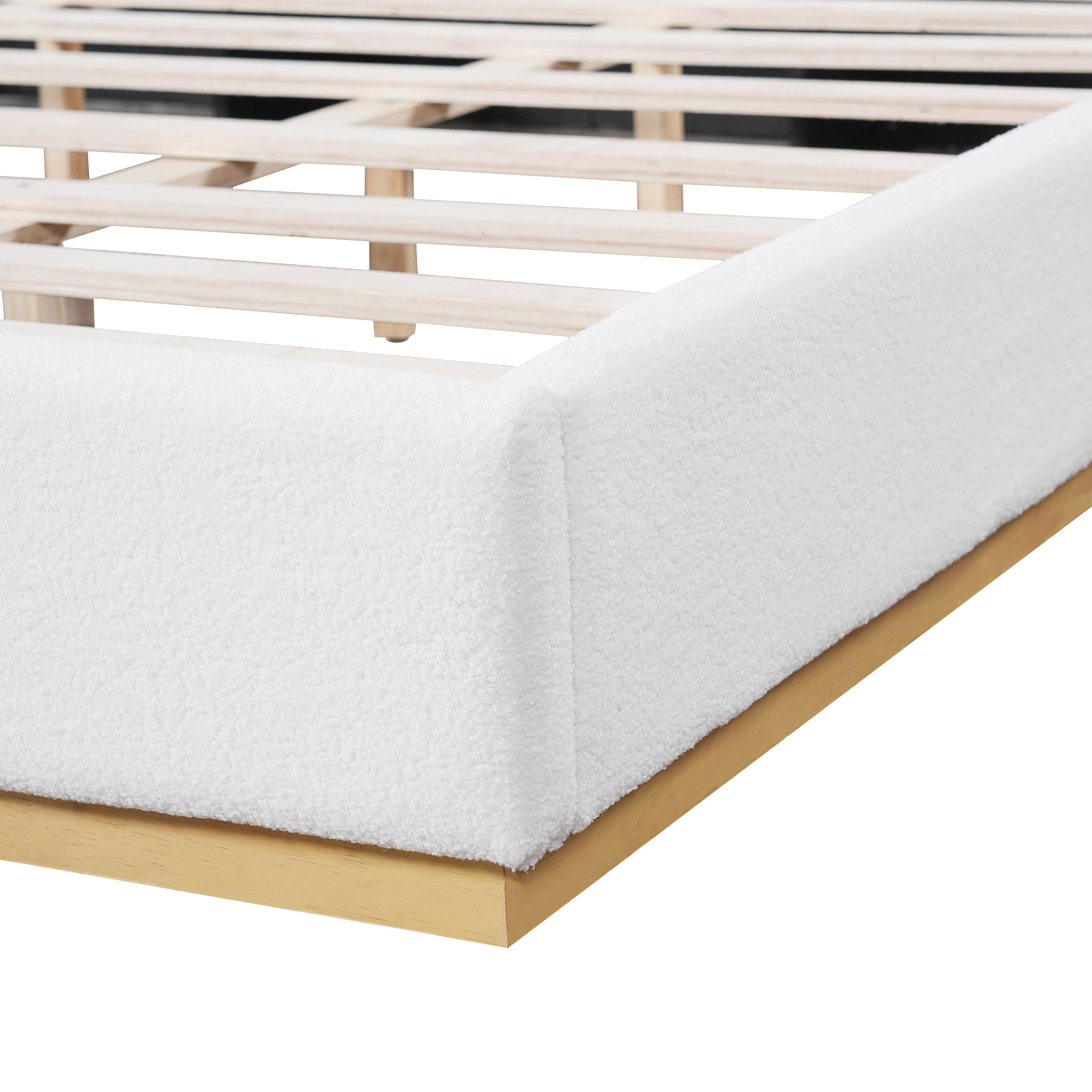 Close-up of wood slats and white bouclé side rail on king bed frame