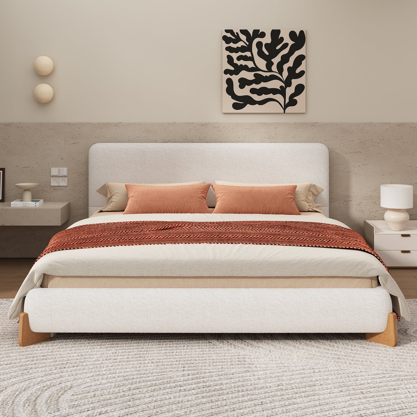 White boucle king bed in a neutral bedroom with rust and cream bedding
