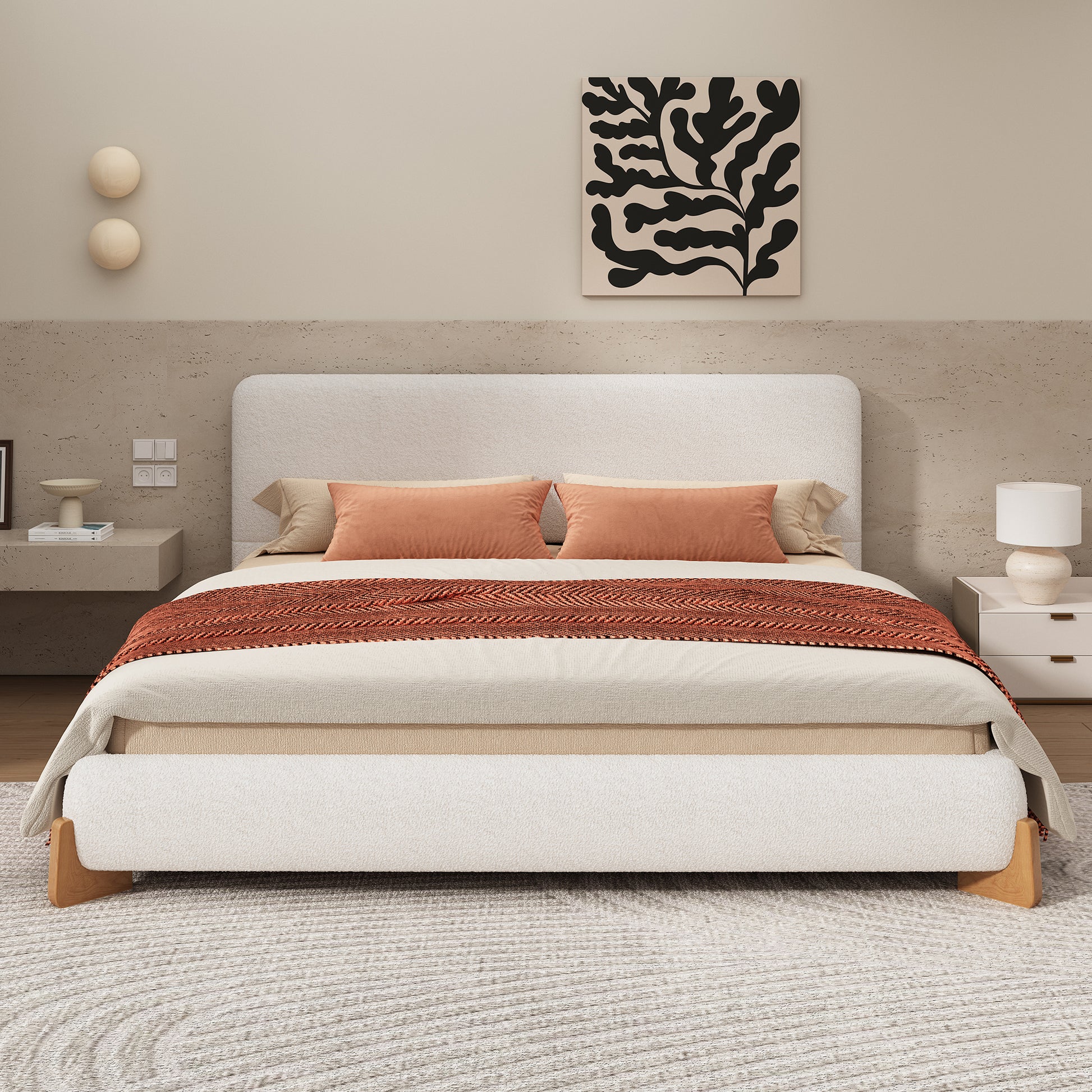 White boucle king bed in a neutral bedroom with rust and cream bedding