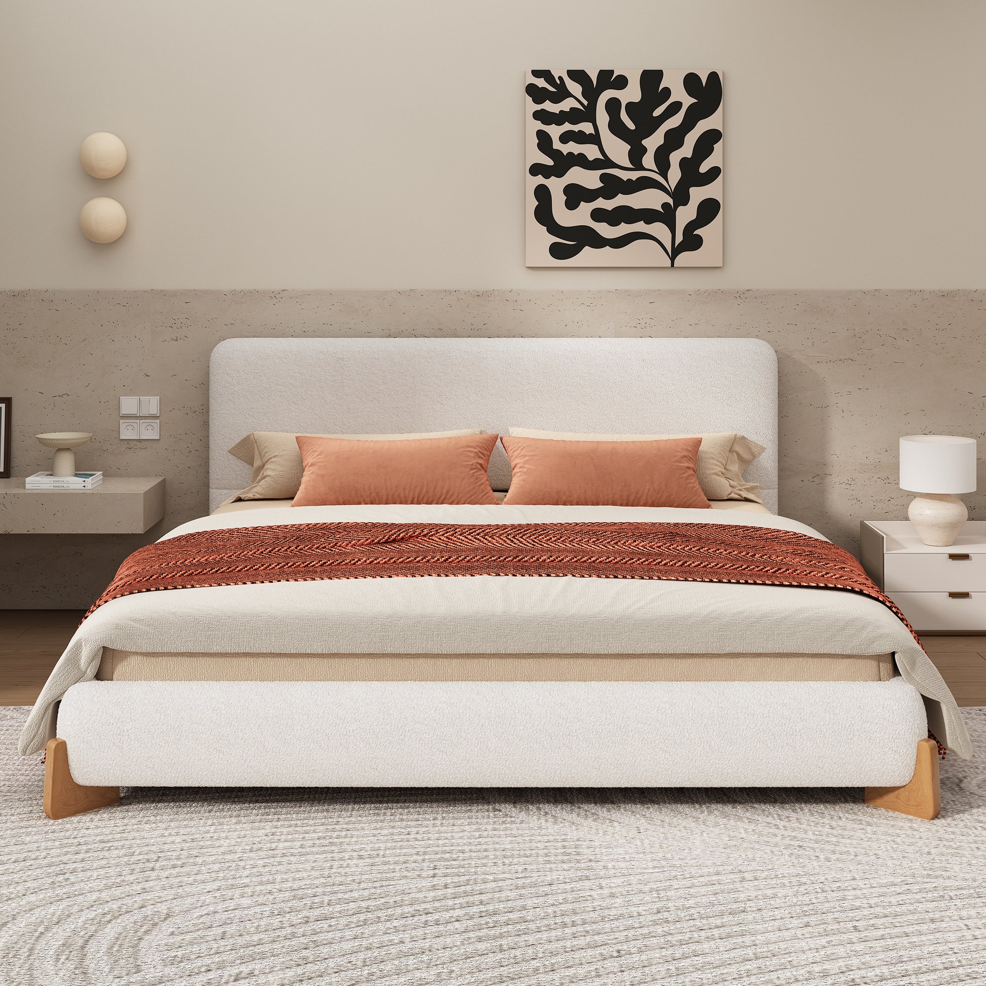 White boucle king bed in a neutral bedroom with rust and cream bedding