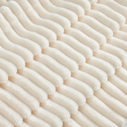 Close-up shot of fluffy cream corduroy sectional highlighting the soft ribbed texture and plush fabric detail.