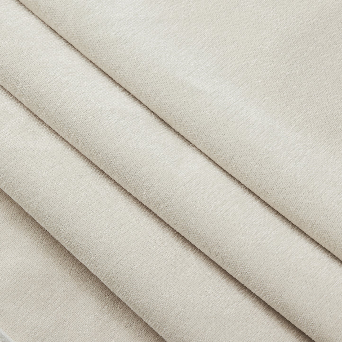 Close-up shot showcasing the plush chenille fabric of a fluffy cream sectional — emphasizing its soft texture, machine washable slipcover, and pet-friendly durability perfect for everyday use.