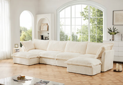 Three-quarter lifestyle view of a fluffy cream corduroy sectional sofa with two ottomans — highlighting its ribbed texture, deep seating, and modular layout in a cozy, pet-friendly living room with machine washable slipcovers for easy care.