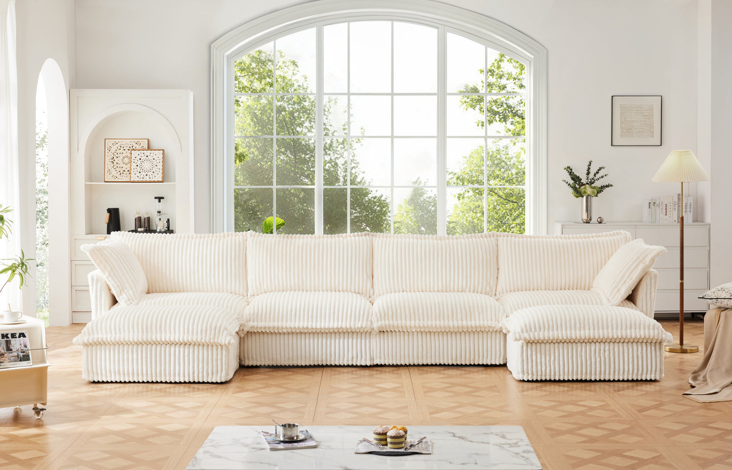 Frontal lifestyle shot of a fluffy cream corduroy sectional with two ottomans — styled in a cozy living room setting. Showcases deep modular seating, ribbed texture, and machine washable slipcovers for a pet-friendly, low-maintenance, and comfortable home centerpiece.