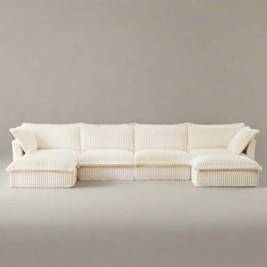 Fluffy 4-seat cream corduroy sectional sofa with two ottomans — featuring ribbed, textured fabric, deep modular seating, and removable, machine washable slipcovers. This pet-friendly couch offers versatile L or U shaped layouts and plush comfort in a modern, cozy design.