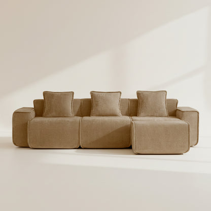 Studio shot of the Seneca boneless couch in mocha showing three seats and an ottoman