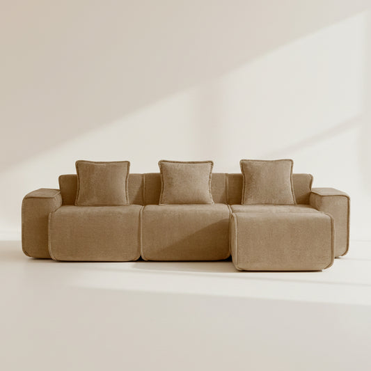 Studio shot of the Seneca boneless couch in mocha showing three seats and an ottoman