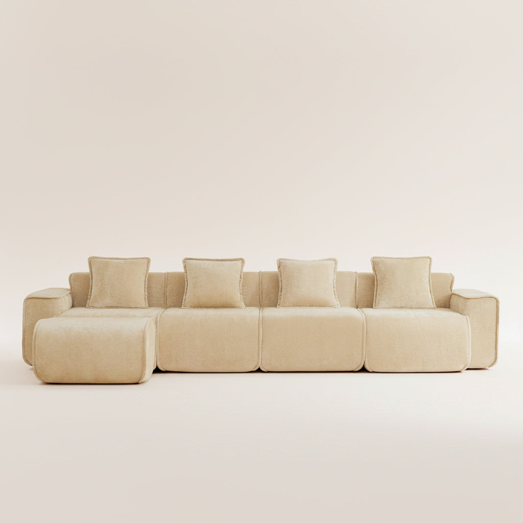 studio shot of the seneca boneless couch in camel with four seats and an ottoman