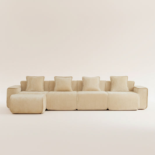 studio shot of the seneca boneless couch in camel with four seats and an ottoman